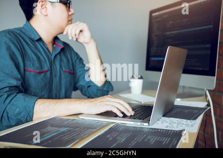 Developing programming and coding technology working in a software develop company office. Stock Photo