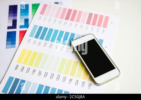 Designer equipment with smartphone on the desk. Stock Photo