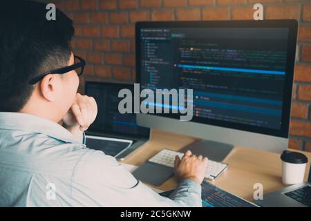 Developing programming and coding technology working in a software develop company office. Stock Photo