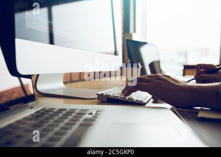 Close up of hands contemporary website developer man typing and writing code for program website. Stock Photo