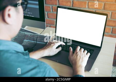 Man working blank screen developing on laptop. Stock Photo