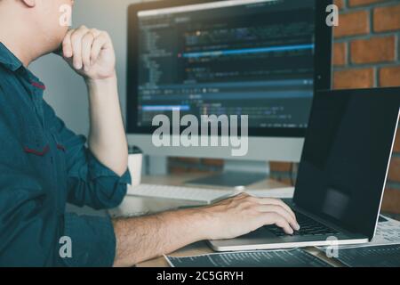 Developing programming and coding technology working in a software develop company office. Stock Photo