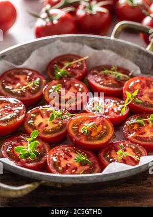 Fresh tomatoes in pan ready to dry or roasted Stock Photo