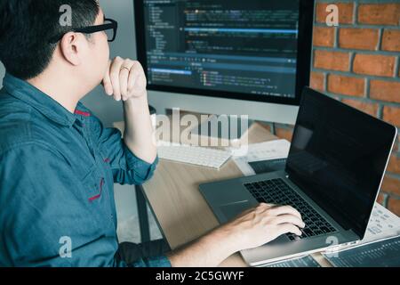 Developing programming and coding technology working in a software develop company office. Stock Photo