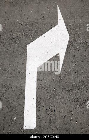 Single arrow directional sign on the floor Stock Photo - Alamy