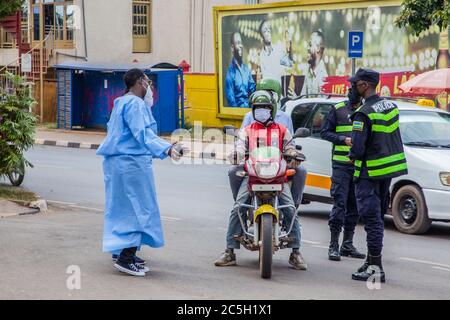 Kigali, Rwanda. 2nd July, 2020. Health workers lead passersby to take COVID-19 testing in Kigali, capital of Rwanda, July 2, 2020. Rwanda's Ministry of Health on Thursday launched a COVID-19 street testing survey in Kigali to probe the COVID-19 situation in the city. Credit: Cyril Ndegeya/Xinhua/Alamy Live News Stock Photo