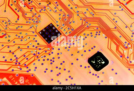 Abstract red computer circuit board close up for background Stock Photo