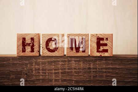 Home word on wooden cubes. Coronavirus COVID-19 outbreak stay home concept Stock Photo