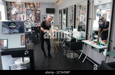 Stylist Caroline Peacock, 41, puts the final preparations in place at Toni & Guy in Newcastle ready for Saturday's re-opening of hair salons. Stock Photo