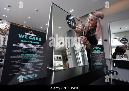 Stylist Caroline Peacock, 41, puts the final preparations in place at Toni & Guy in Newcastle ready for Saturday's re-opening of hair salons. Stock Photo