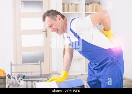 Man worker with back injury, concept of accident at work Stock Photo