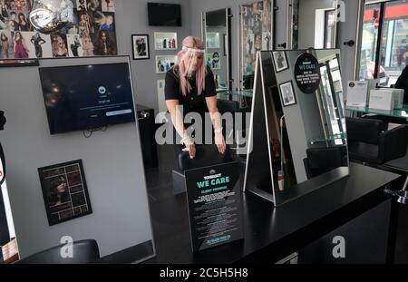 Stylist Caroline Peacock, 41, puts the final preparations in place at Toni & Guy in Newcastle ready for Saturday's re-opening of hair salons. Stock Photo