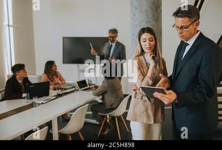 Creative executives using digital tablet in the office Stock Photo