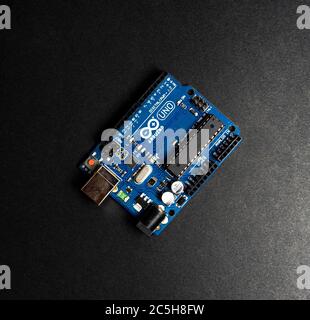 Sankt-Petersburg, Russia - February 28, 2020: Arduino UNO board on black background, close up. Microcontroller for programming. Stock Photo