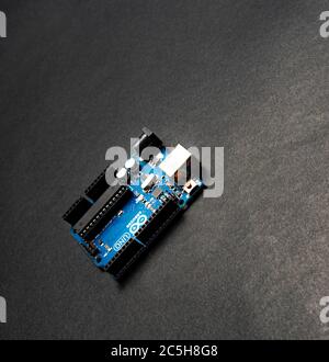 Sankt-Petersburg, Russia - February 28, 2020: Arduino UNO board on black background, close up. Microcontroller for programming. Stock Photo