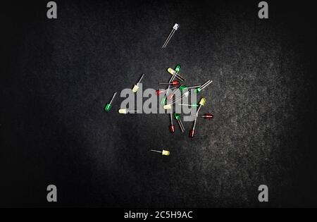 Small colorful LED diodes. Electroluminescent semiconductor light emitting source. Electrotechnical background. Red, blue, green or yellow transparent Stock Photo