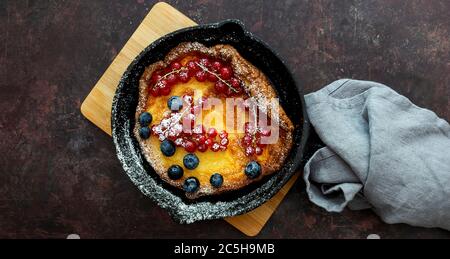 Top view of Dutch or german baby pancake in skillet iron pan  Stock Photo