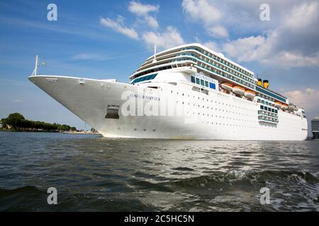 AMSTERDAM, NETHERLANDS -JULY 7: Costa Romantica enters the port of Amsterdam. Sister ship to the Costa Concordia, which sank in Italy, January 13, 201 Stock Photo