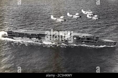 HMS FURIOUS (47)  Royal Navy battlecruiser modified as an aircraft carrier during construction.  With her Fairy Swordfish aircraft about 1935. Stock Photo