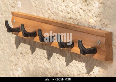 Towel hook. Empty bathroom rack. cloth hanger. classic exterior hotel bath garment storage. elegance vintage wooden holder. close-up of retro wall bat Stock Photo