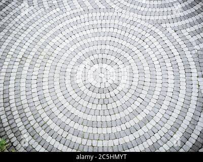 The paving gravel tile is patterned in a circle Stock Photo