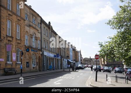 A row of shops on The High Street in Chipping Norton in West Oxfordshire in England Stock Photo