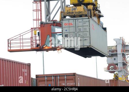 Rail mounted crane being used to load and unload shipping containers at ...
