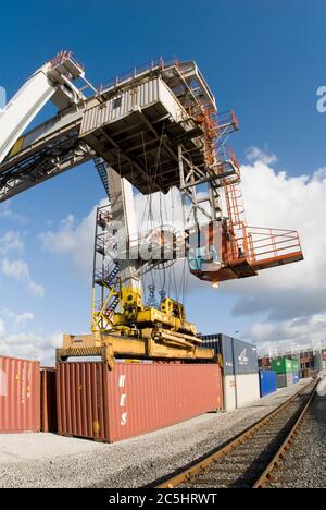 A large crane used for loading containers on cargo ships Stock Photo ...