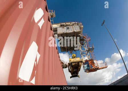 Rail mounted crane being used to load and unload shipping containers at ...