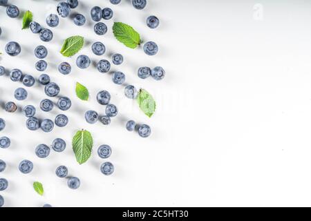 Flatlay pattern with fresh ripe blueberries on white background Stock Photo
