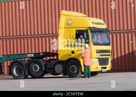 Freightliner lorry driver speaking with a colleague at Manchester Euroterminal, Trafford Park, Manchester, England. Stock Photo