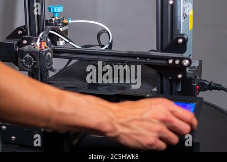 3D plastic printer during work in a factory three dimensional printing. Close-up detail. Stock Photo