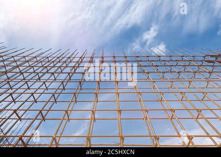 Steel reinforcement bar and timber form works at construction site on blue sky background Stock Photo
