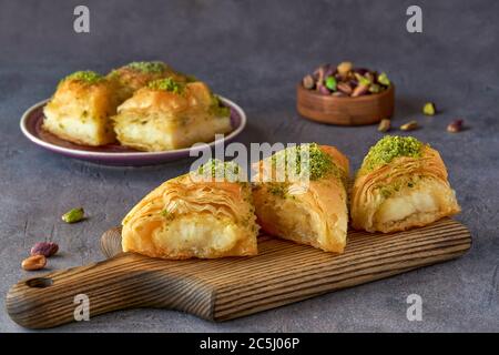 Sweets arabic dessert kunefe, kunafa, kadayif with pistachio and cheese Stock Photo