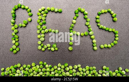 Peas forming the word pease Stock Photo