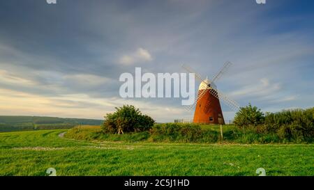 Halnaker, UK - May 18, 2020: Halnaker windmill, recently restored, in a spring sunset on the South Downs near Chichester, West Sussex, UK Stock Photo