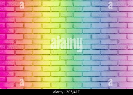 Colored rainbow of grunge wall background. Idea of colorful painted old vintage grungy brick wall texture. Stock Photo