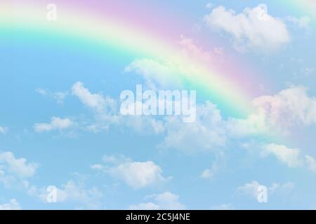 Rainbow on blue sky with white cloud background. Stock Photo
