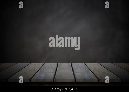 Empty wood table top over blur blackboard background. Stock Photo