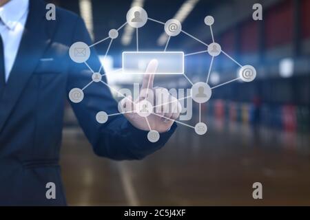 Businessman hand pressing blank button with icon on virtual screen. Stock Photo