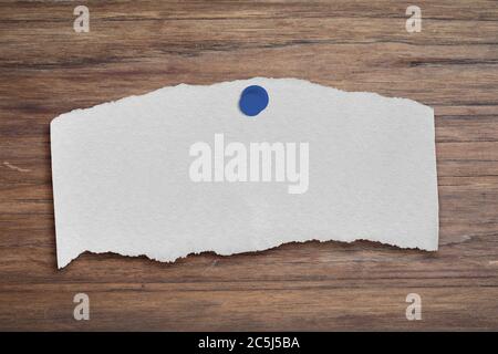 White paper post-it on wood table background. Copy space for your text Stock Photo
