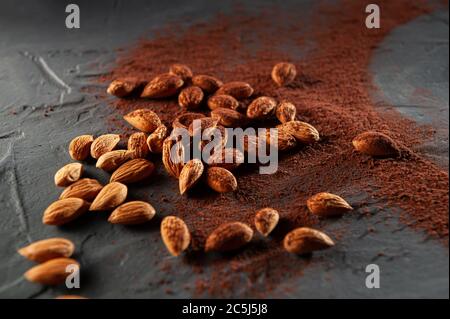 Cacao beans and powder isolated on grey background. Top view Stock Photo