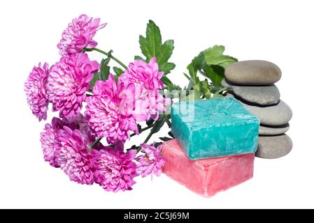 soaps off various shades with grey sone pebbles and flowers Stock Photo