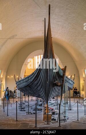 Oslo, Ostlandet / Norway - 2019/08/31: Oseberg ship excavated from ship burial archeological site, exhibited in Viking Ship Museum on Bygdoy peninsula Stock Photo