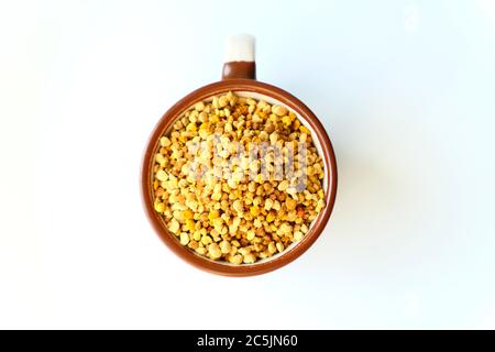 Bee pollen grains in a cup Stock Photo