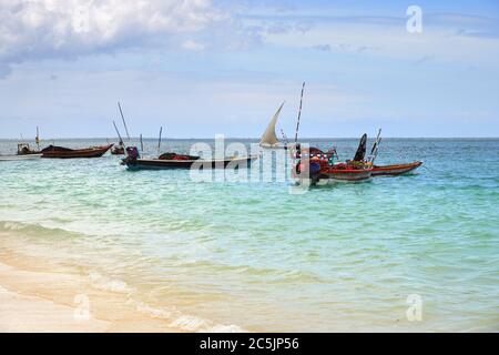 Fishing boats moored near beach at dawn, Zanzibar, Tanzania, Africa