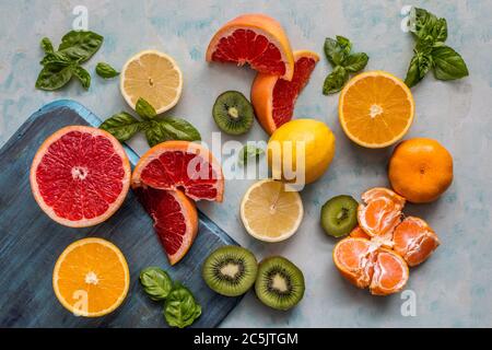 citrus fruit kiwi and basil tabletop flatlay still-life Stock Photo