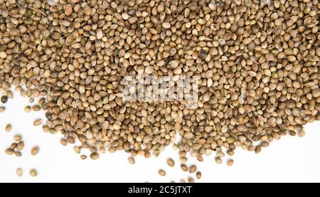 Hemp seed background with white copy space. Natural texture in macro Stock Photo
