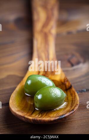 bowl olives, Modern Alamy on Stock space bowl still glass and of olives with minimal wooden oil oil - and green table. and branch life, olive Olive white copy Photo a