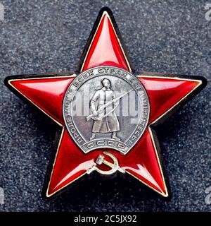 Soviet Order Red Star on granite background Stock Photo